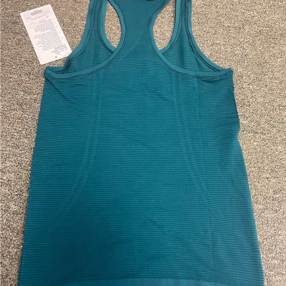 Lululemon Swiftly Speed Racerback
NWT
Size 4
Emerald - Picture 2 of 5